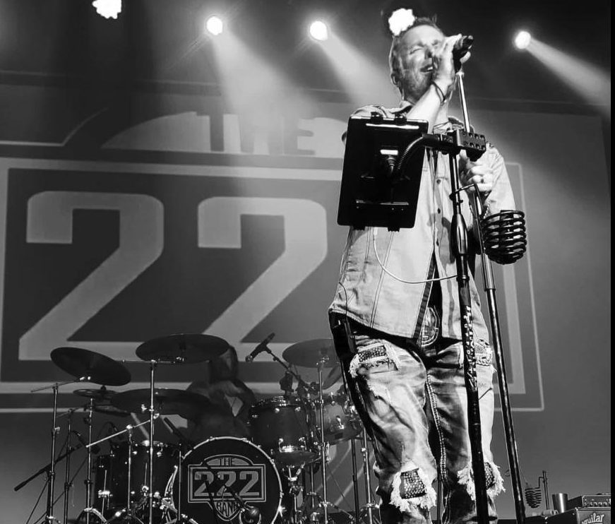 Chris Taff performing live on stage with his band, The 222
